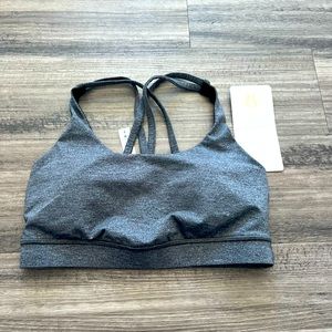 Grey Lululemon Energy Sports bra with cross-cross straps. Never worn with tags